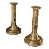 Pair of brass torch candle holders with pushers