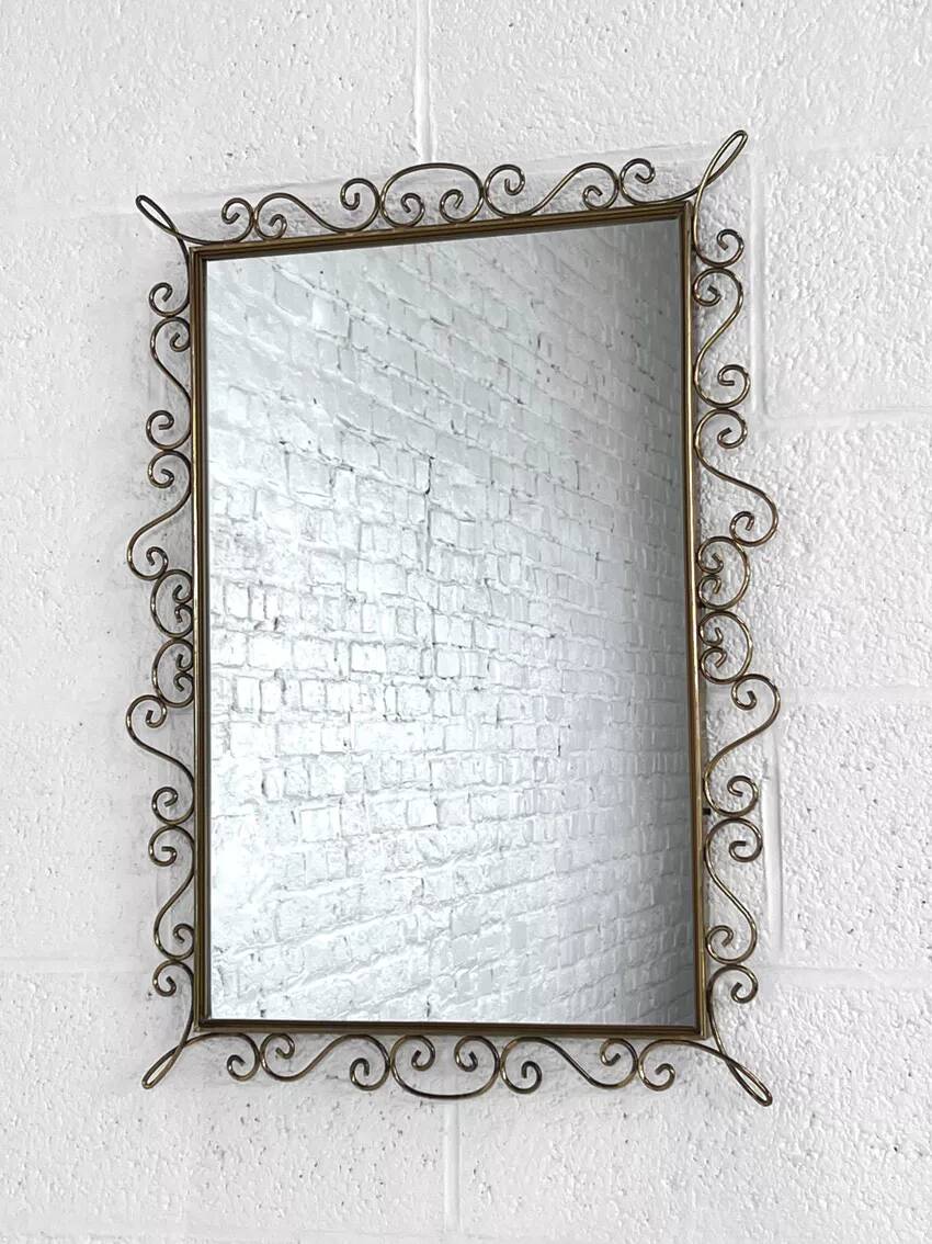 Rectangular mirror from the 50s-60s on a brass frame.
