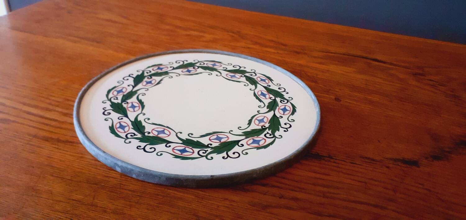 Porcelain and zinc trivet circa 1900