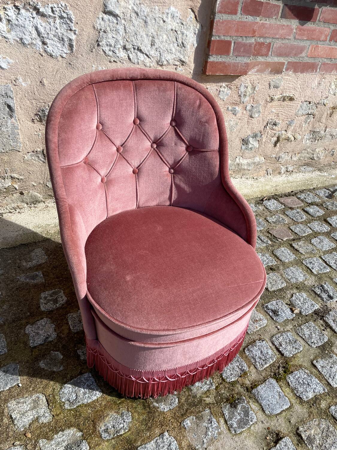 Pink velvet armchair