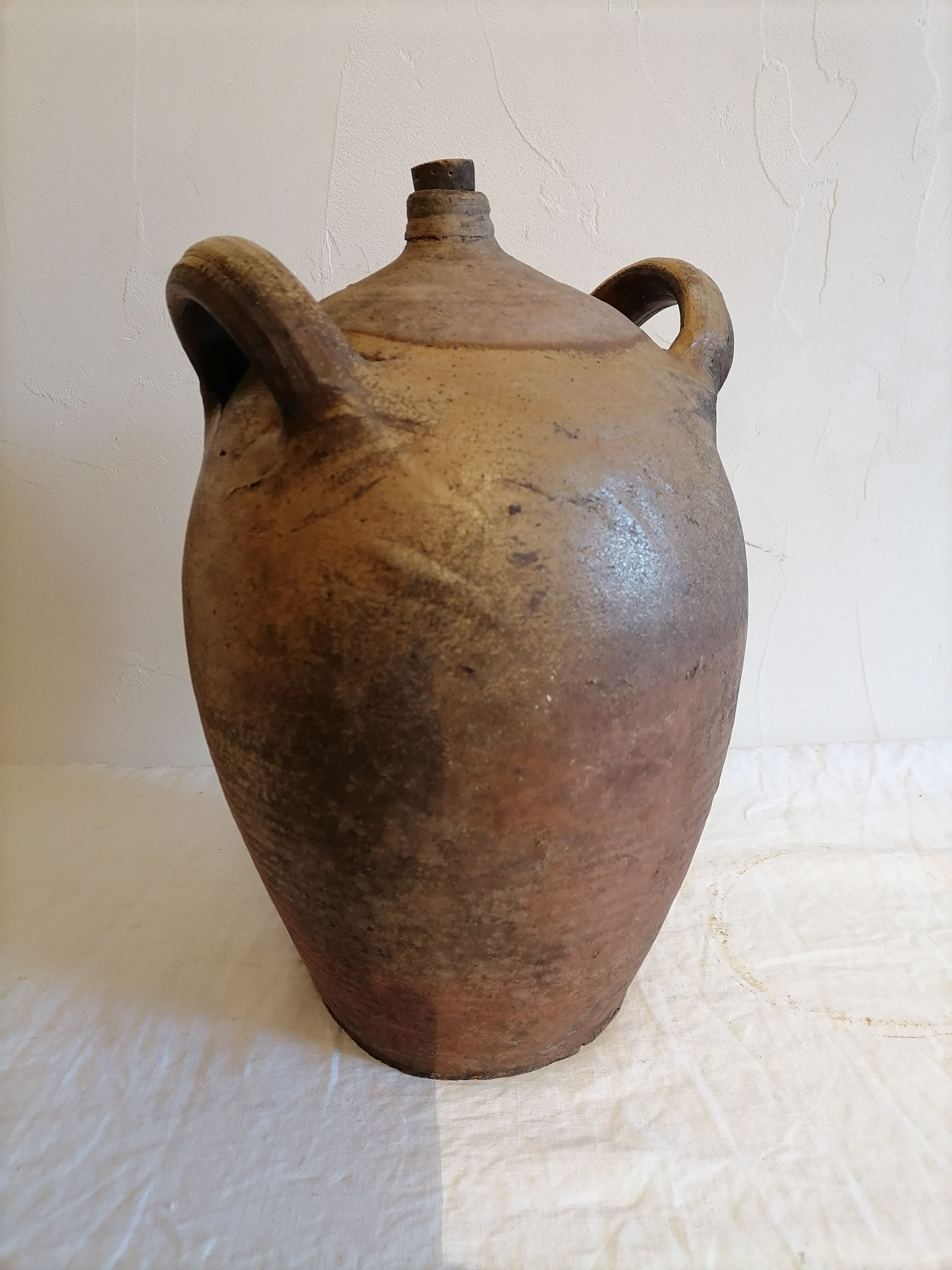 Old jar, glazed sandstone jug. Early twentieth century.