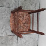 Vintage low stool with straw seat