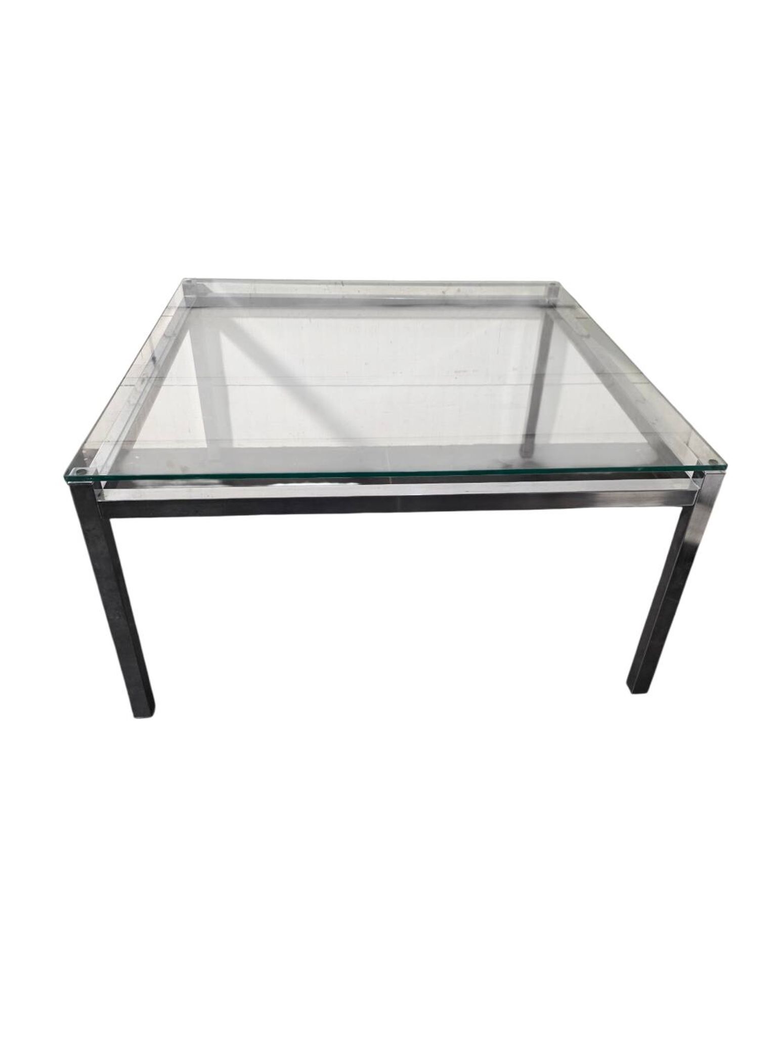 Chrome metal coffee table with a glass top from the 1970s.