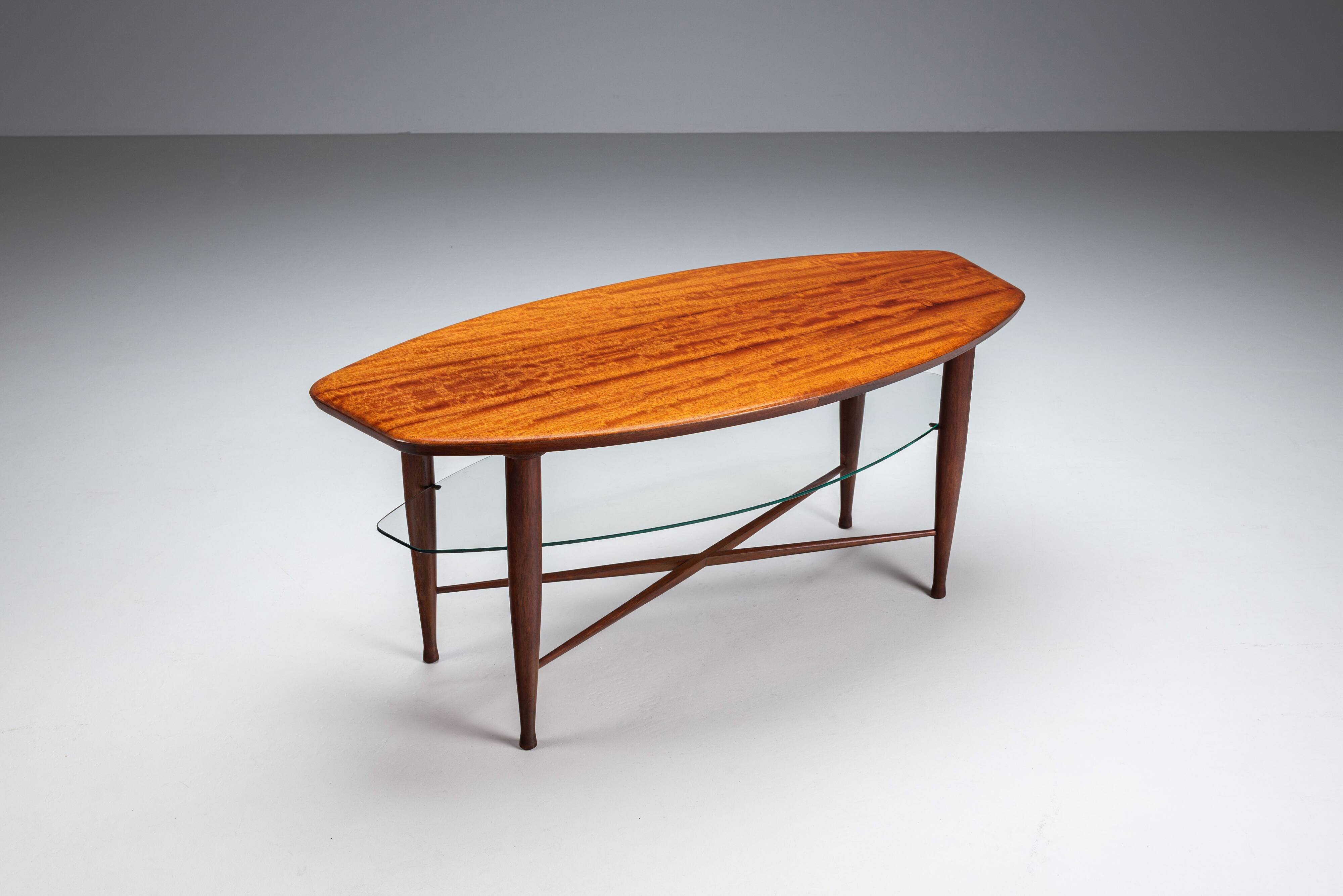 Assymetrical coffeetable with glass storage and cross leg details