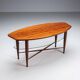 Assymetrical coffeetable with glass storage and cross leg details