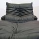 Togo armchair and footrest in black leather by Ligne Roset, designed by Michel Ducaroy.