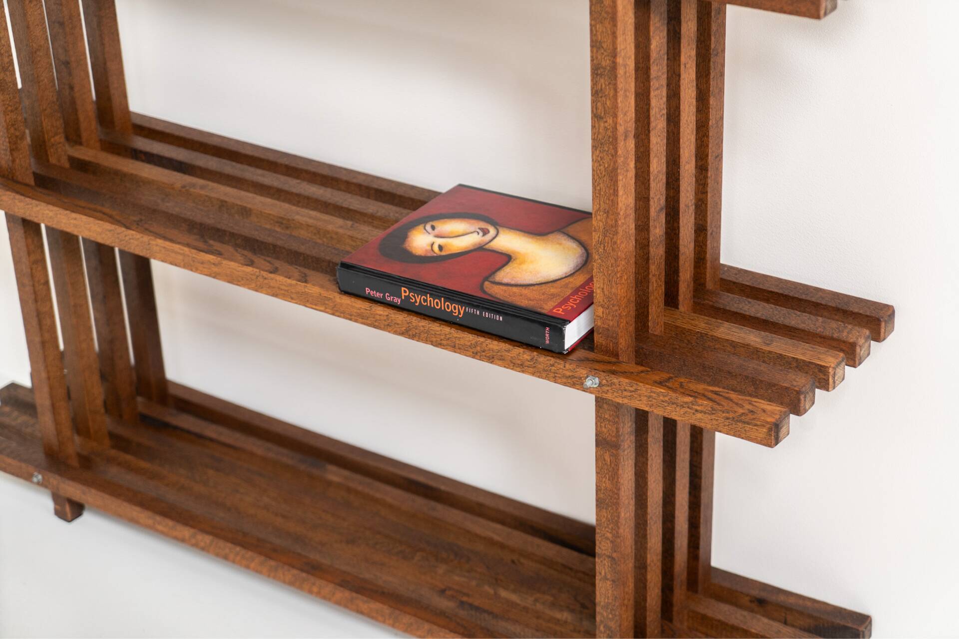 Sculptural wengé slat bookcase (Europe, 1960s).