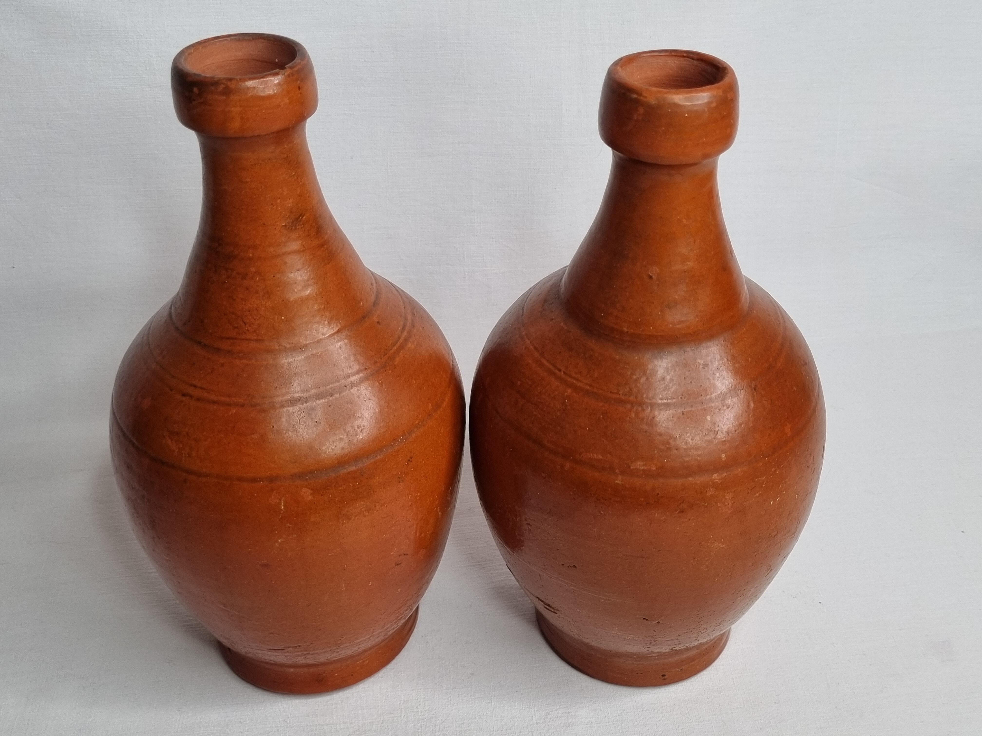 Pair of glazed terracotta jars, 26 cm