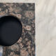 Grey and black speckled marble ashtray