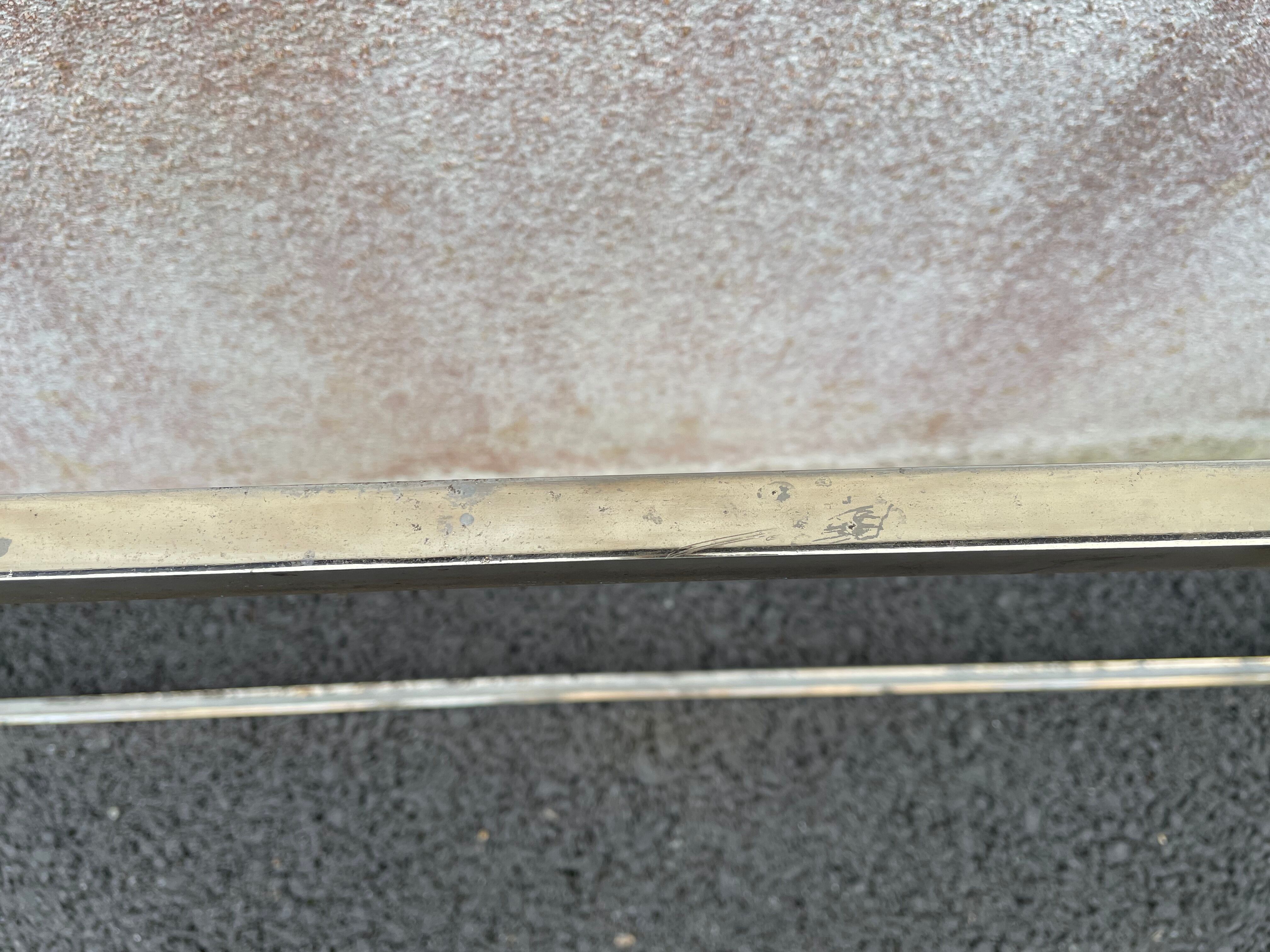 Coffee table in gilded brass and veined green marble