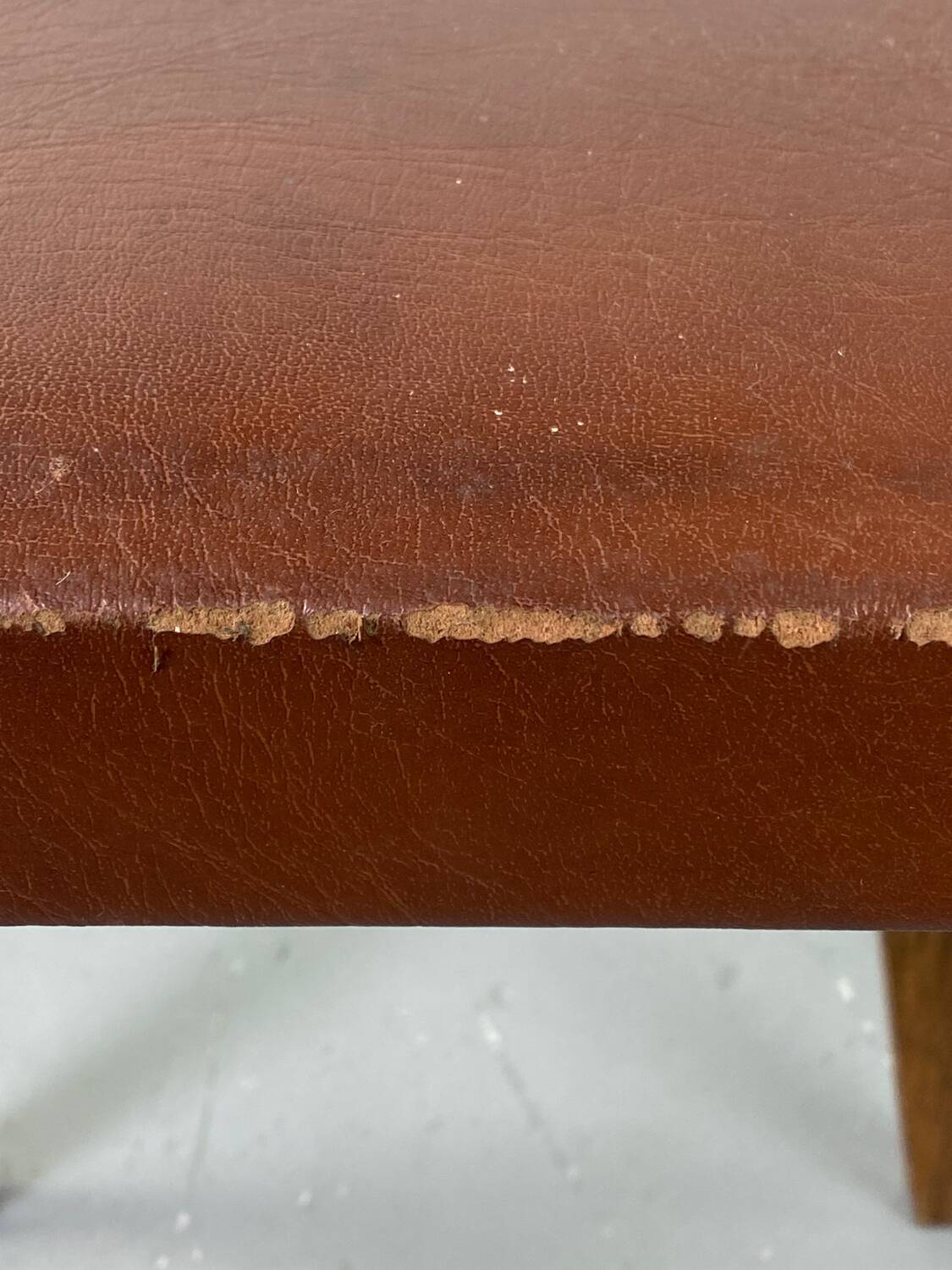 Small stool or footrest in wood and leather