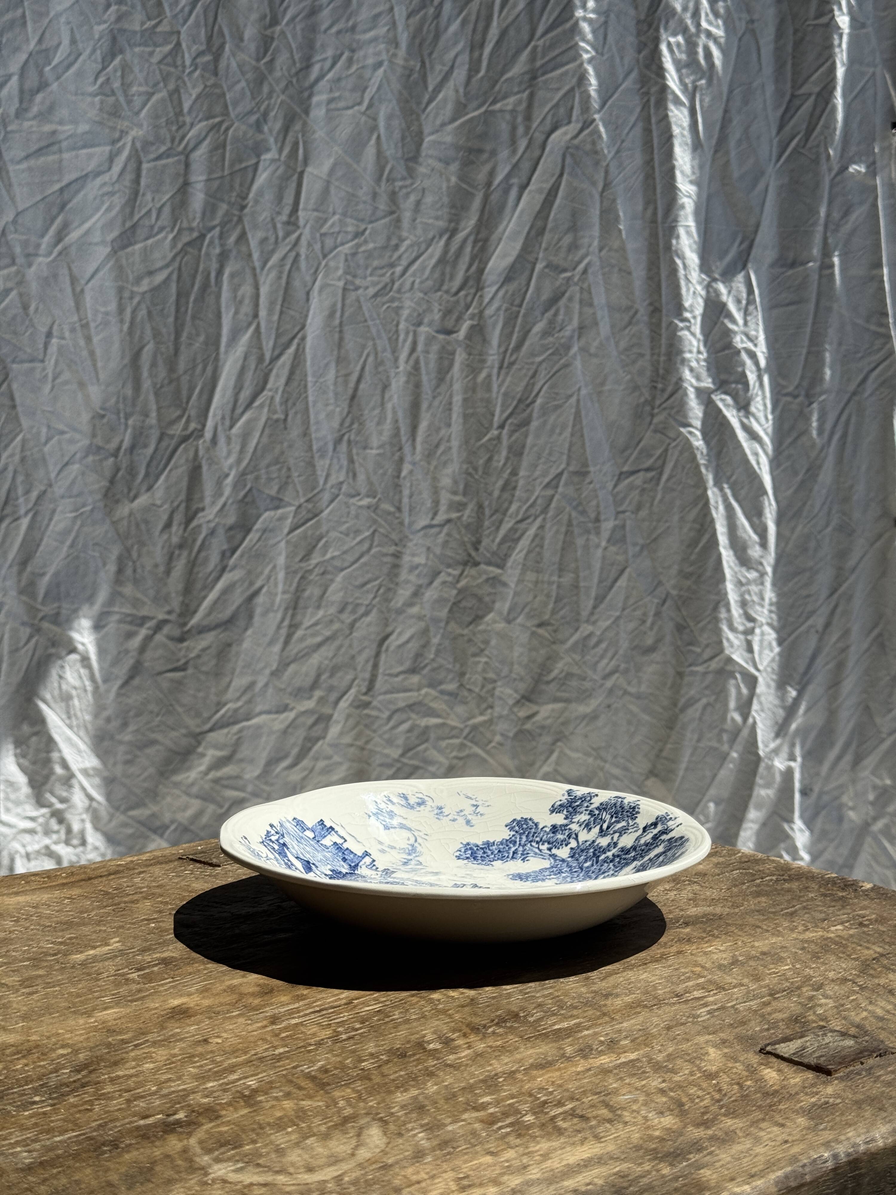 Small deep Gien earthenware plate with blue landscape motif D21.5
