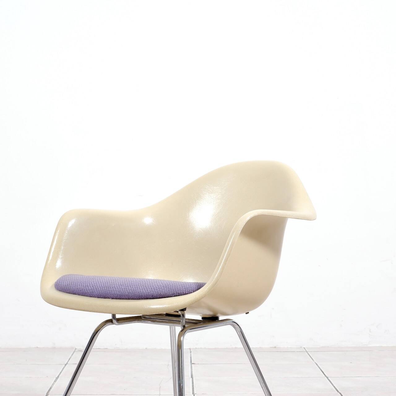 4 Eames DAX fiberglass lounge chairs with purple upholstery by Herman Mille