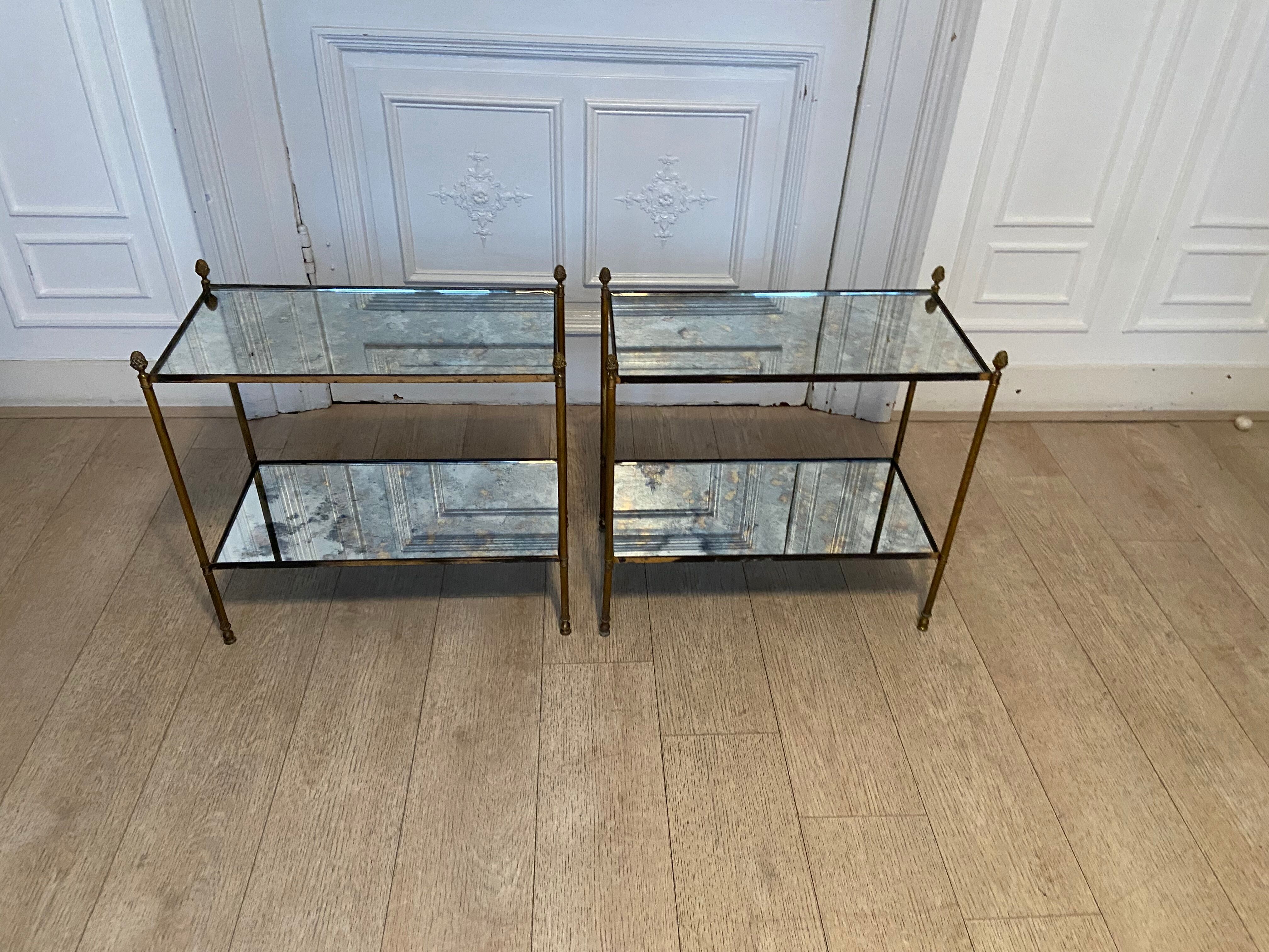 Pair of neo classic brass side tables and oxidized mirror