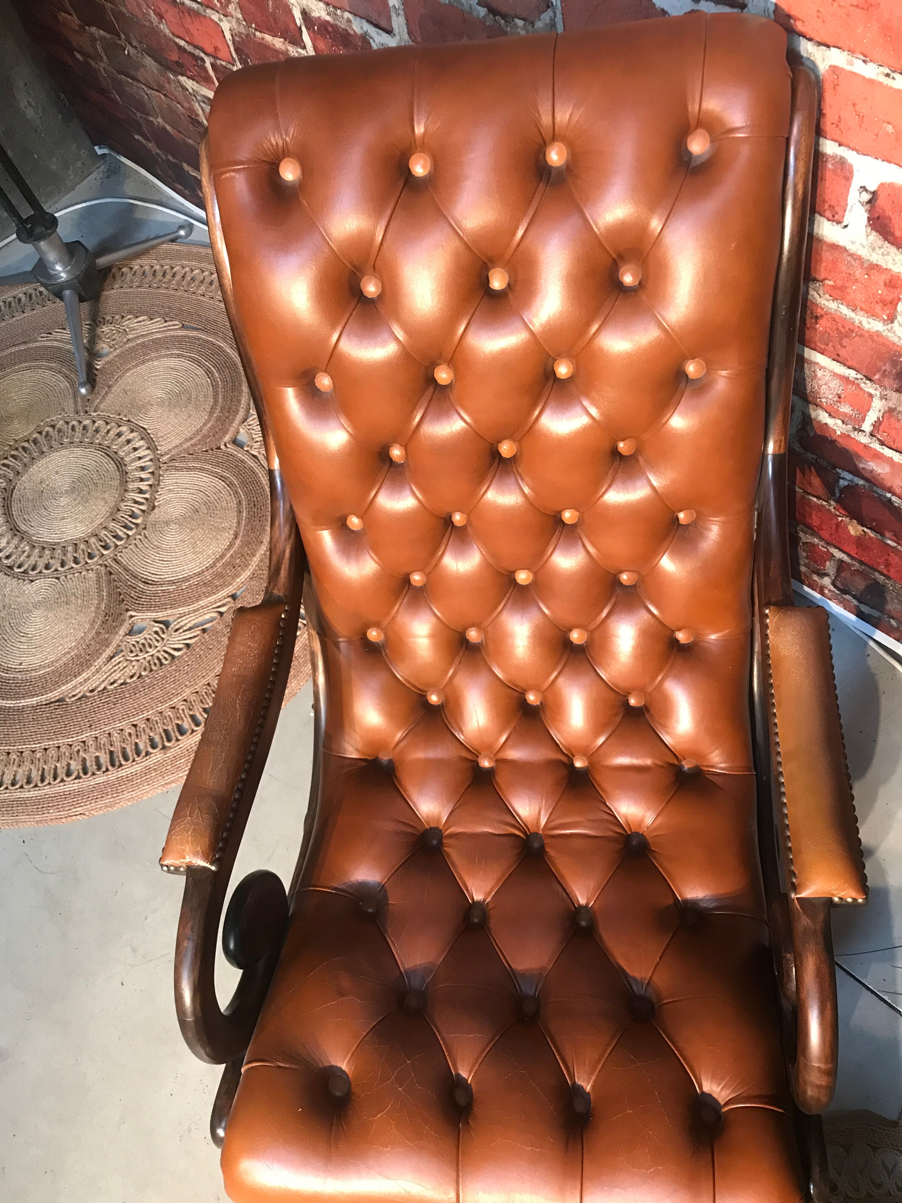 Chair padded and are resting foot.