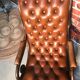 Chair padded and are resting foot.