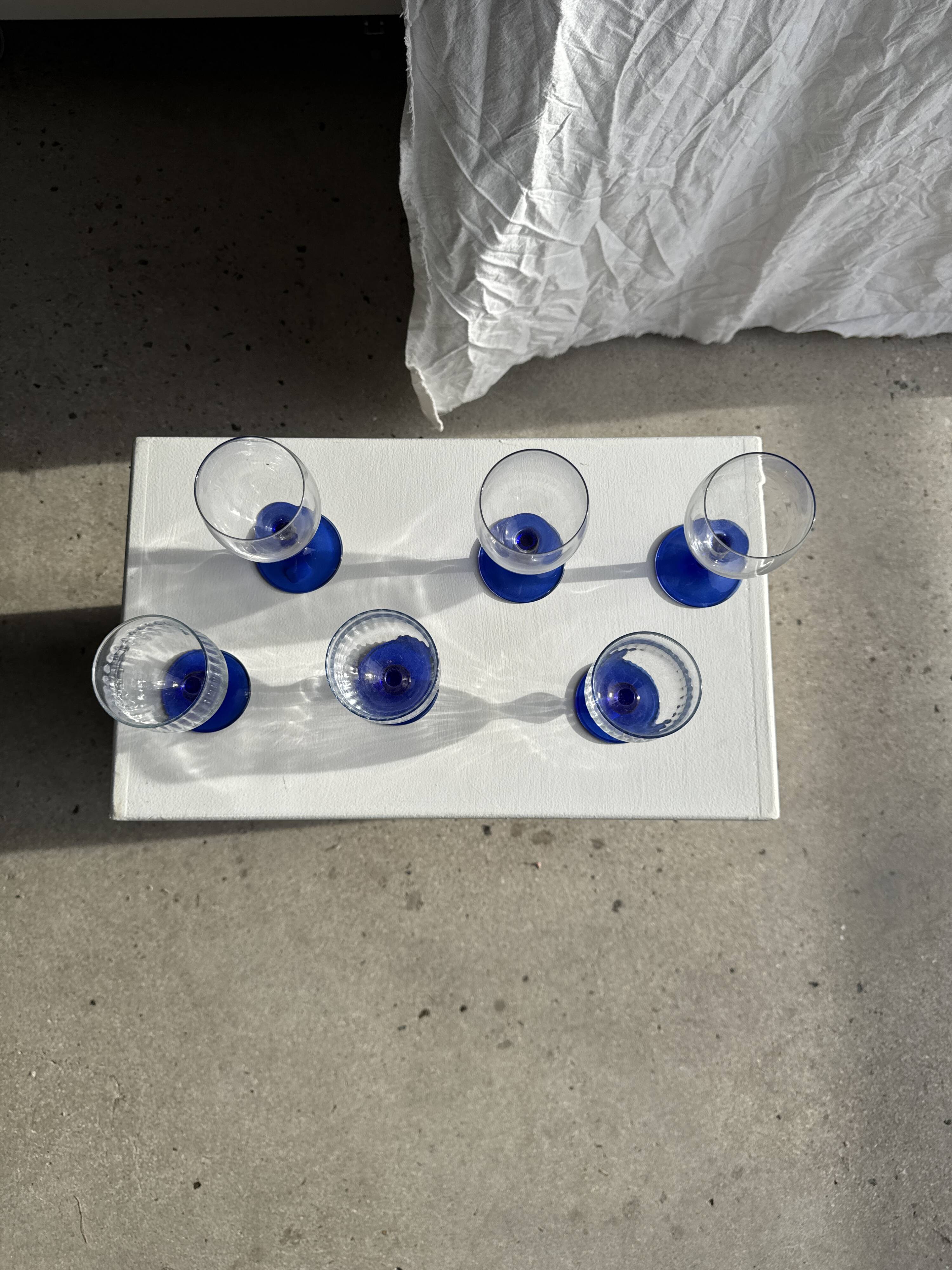 Set of 3 large blue stemmed glasses and 3 small blue stemmed glasses