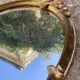 Oval mirror - wood and gilded stucco with decoration of