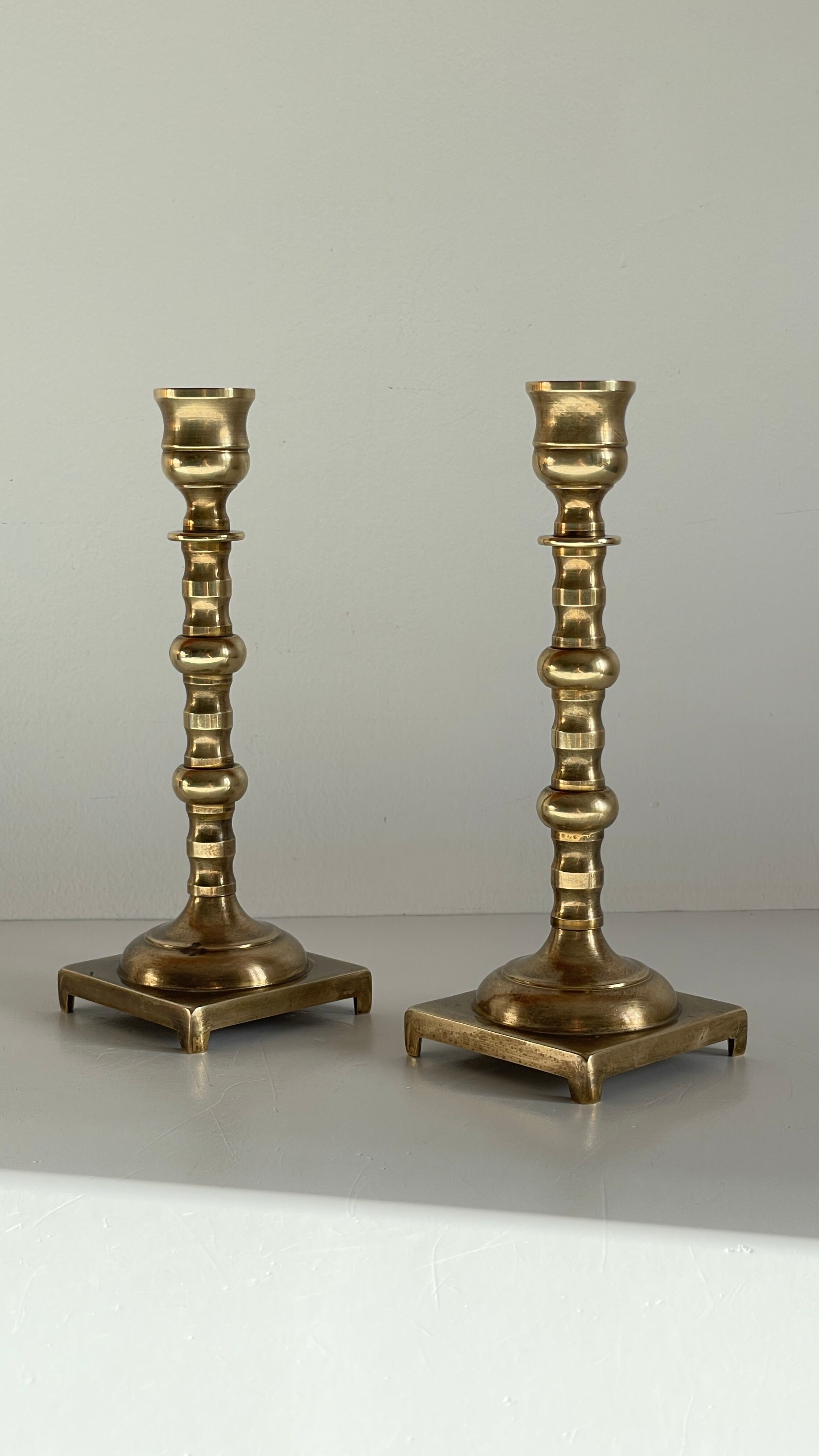 Pair of brass candle holders made in England