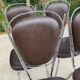Set of 4 vintage chairs from the 60s/70s in brown faux leather with chrome compass legs.