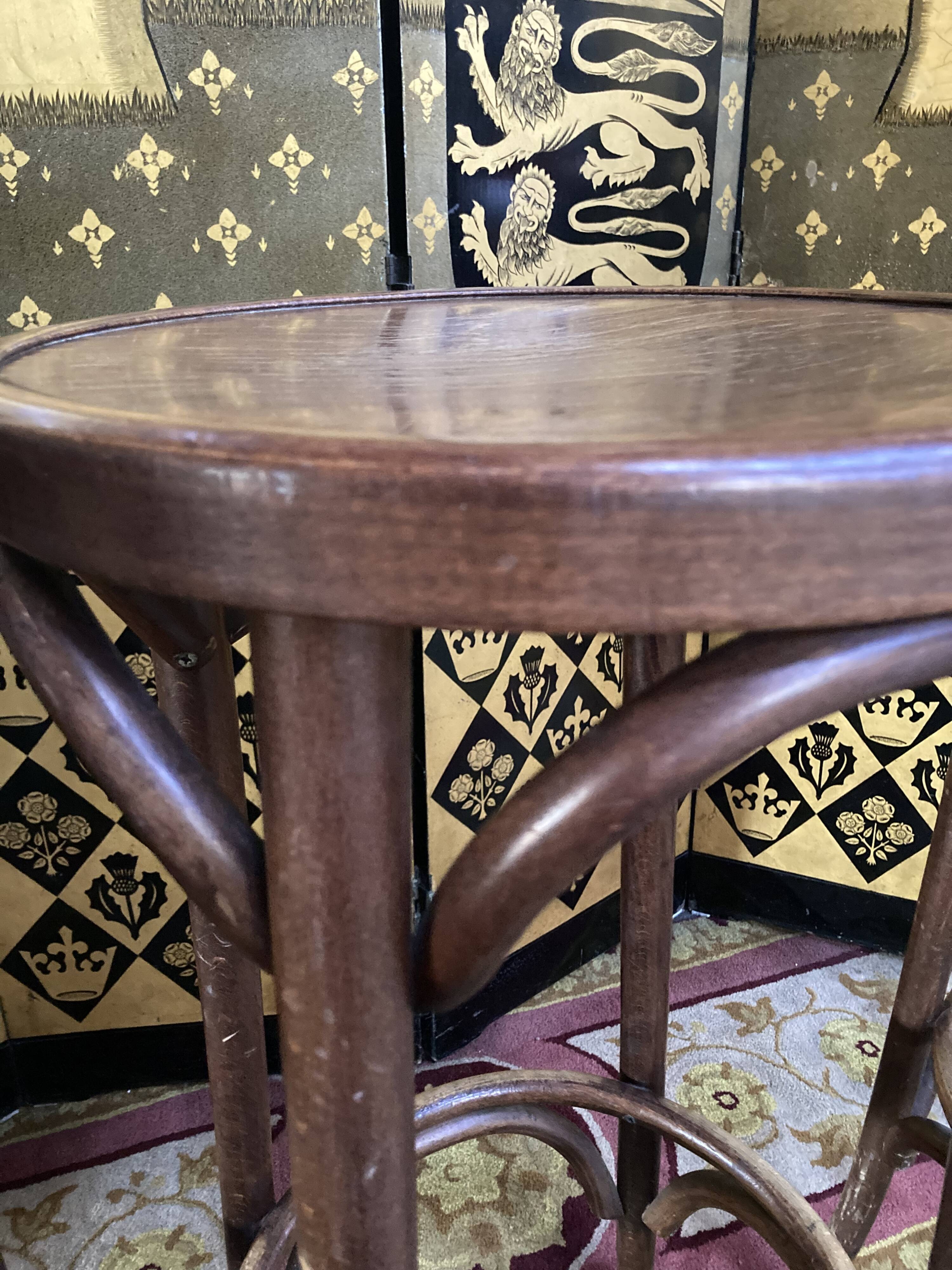 3 curved wooden bar stools