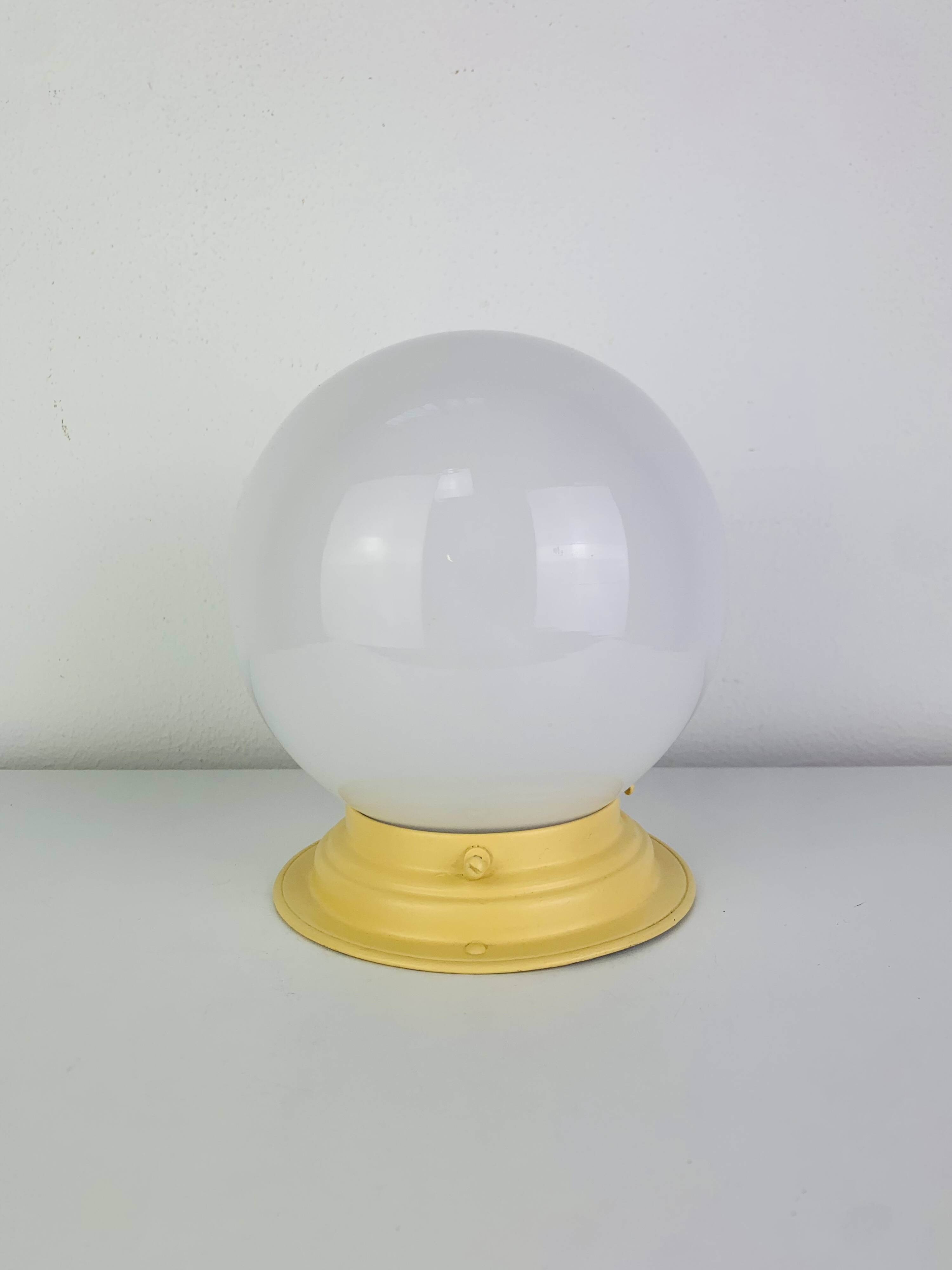Art Deco opaline globe wall or ceiling light, yellow base