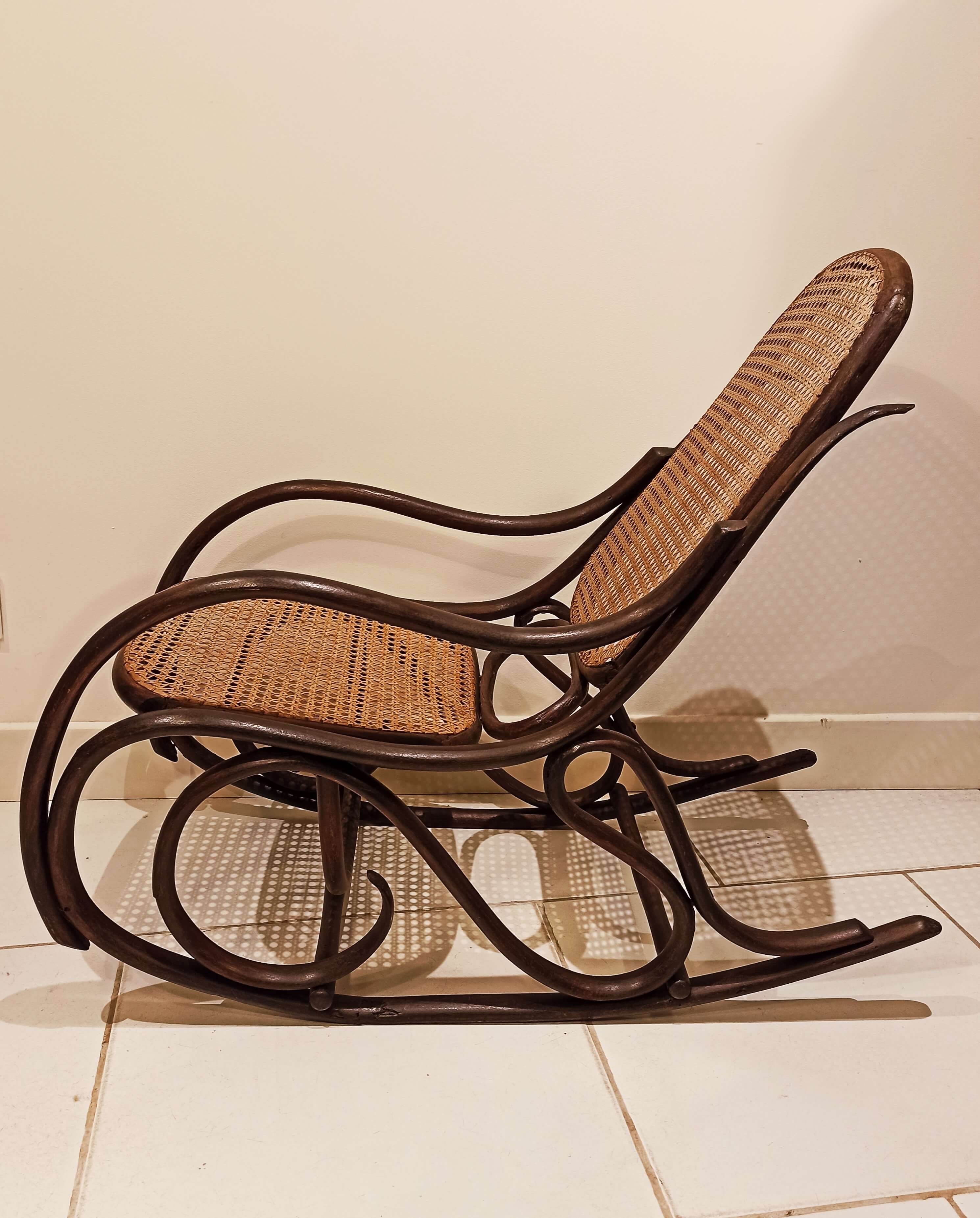 Vintage rocking chair for children in dark rattan and canework, rocking chair