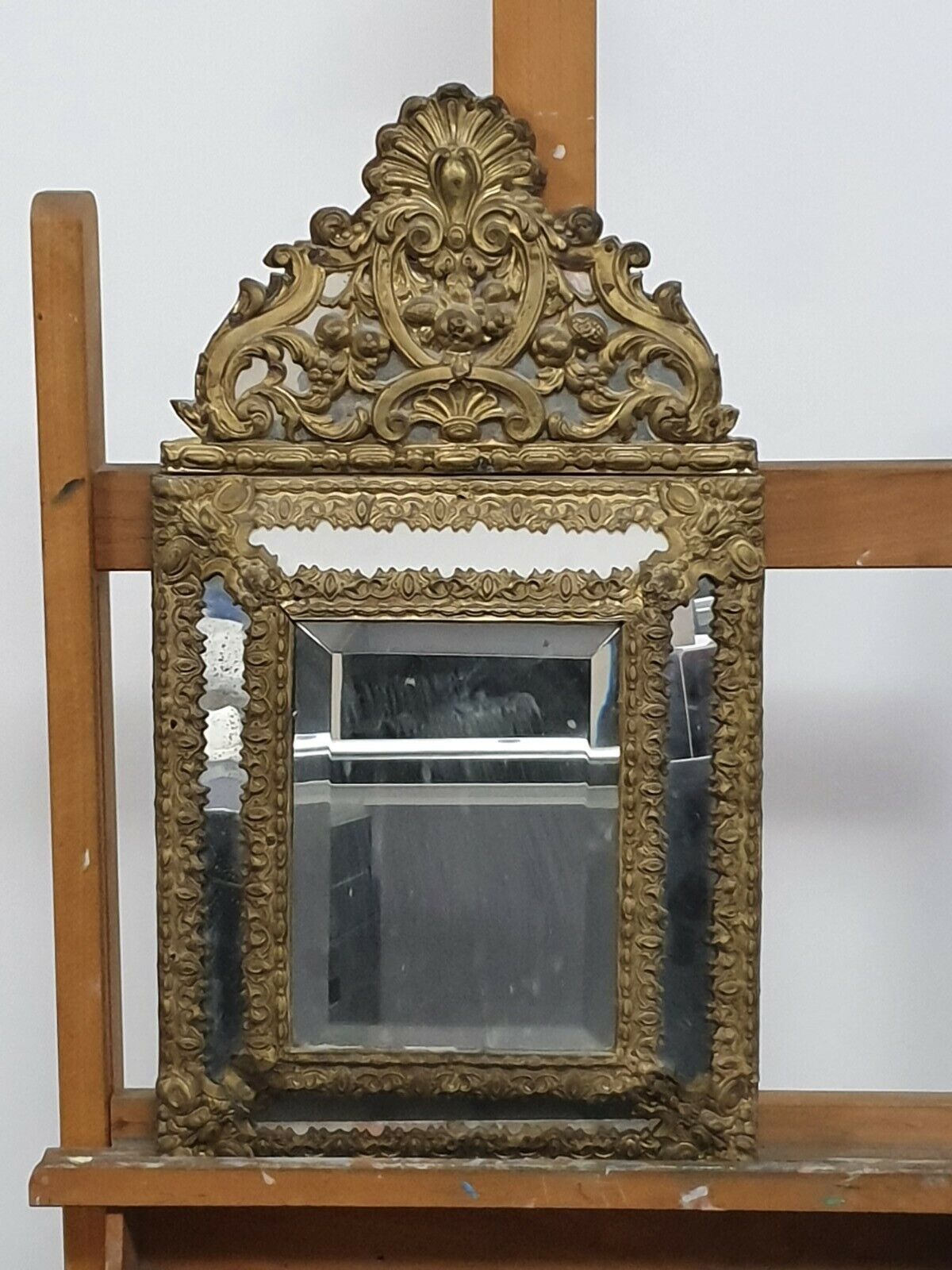 Old bevel mirror with metal parcloses pushed back Louis XIV style