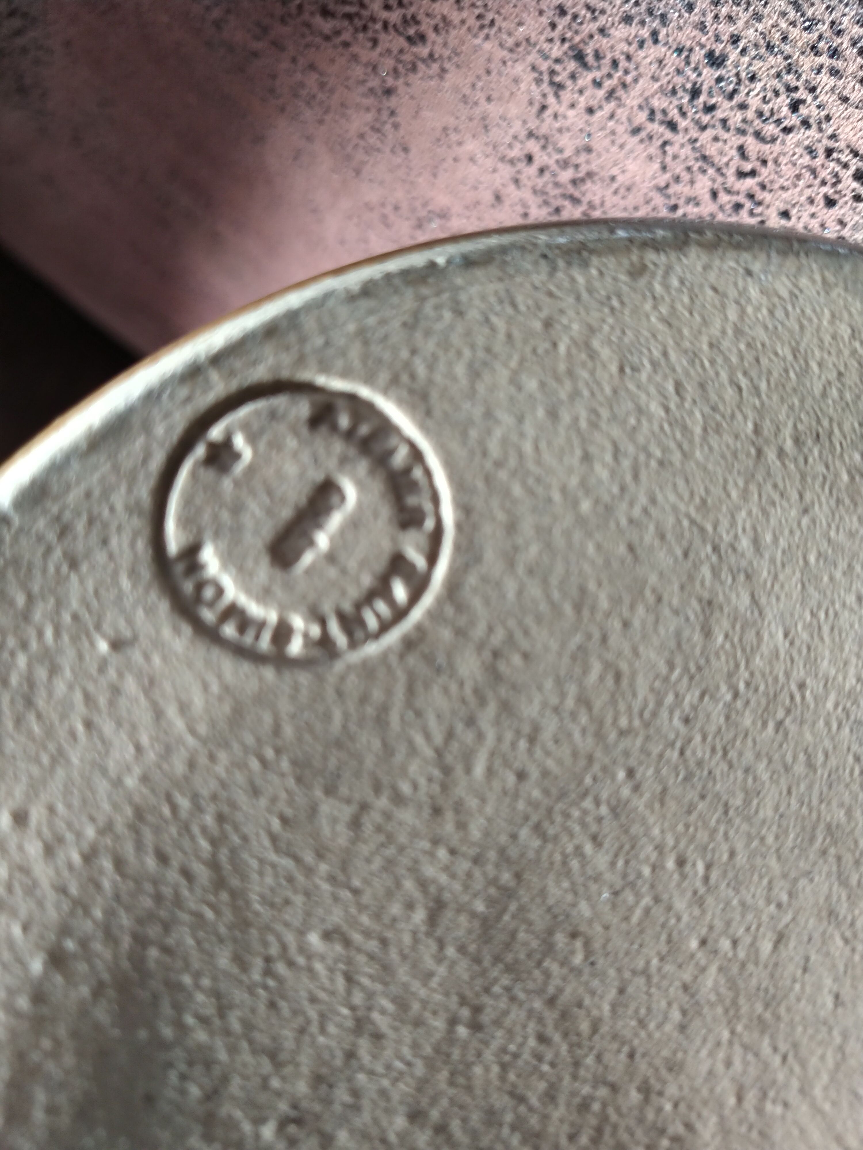 Purple enamelled sandstone vase