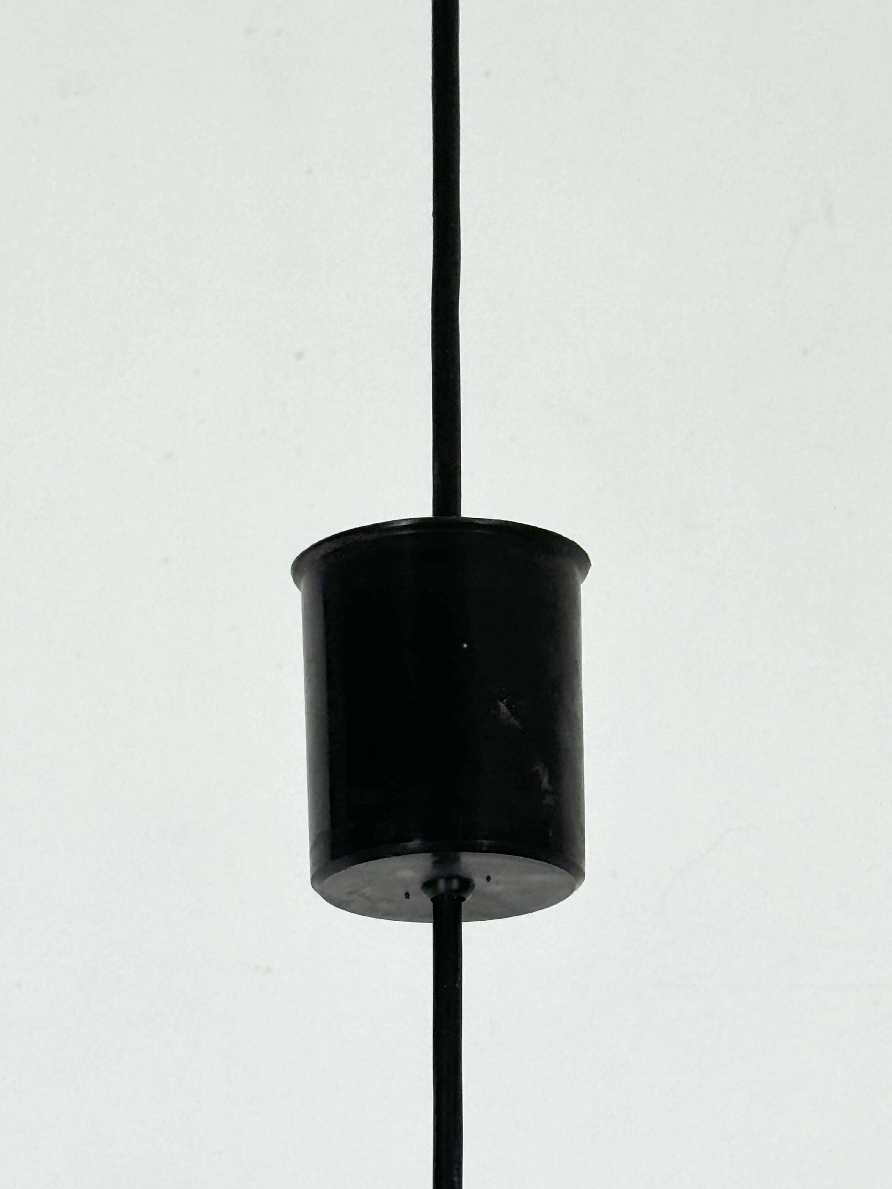 Mid-Century Harvey Guzzini pendant from 1960s. Labeled.