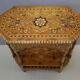 Oriental pedestal table in hexagonal shape made of cedar wood and marquetry