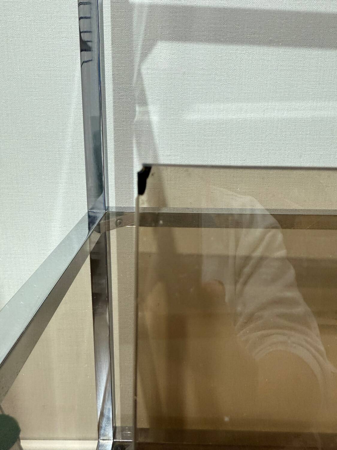 Stainless steel shelf and smoked glass