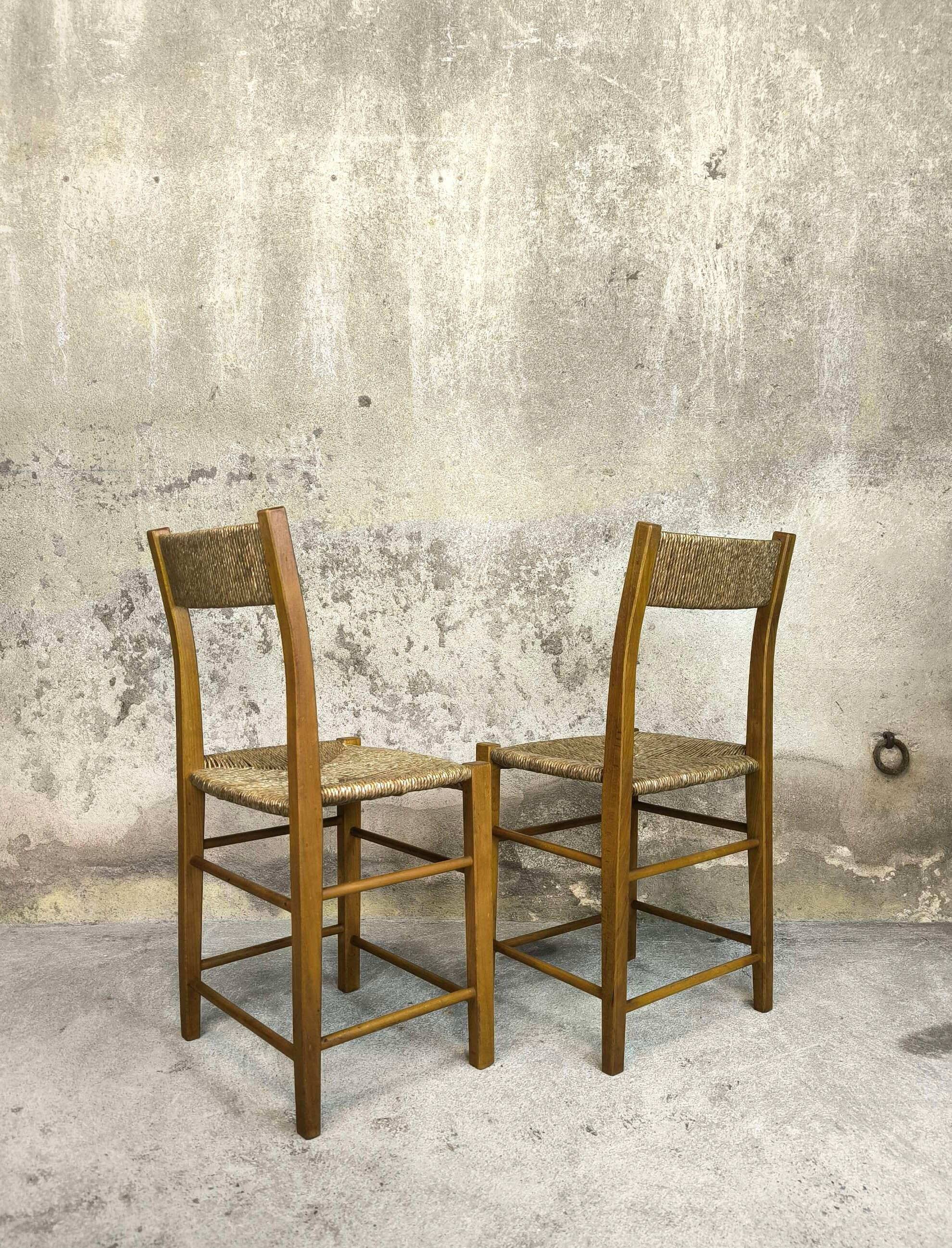 Pair of vintage wood and straw chairs