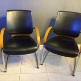 Chairs in leather, walnut and chrome