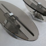 Pair of smoked glass and vintage chrome wall lamps