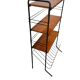 Vintage black shelf/coat rack with wooden accents.