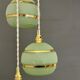 Suspension triple vintage glass globes in frosted green and gold.