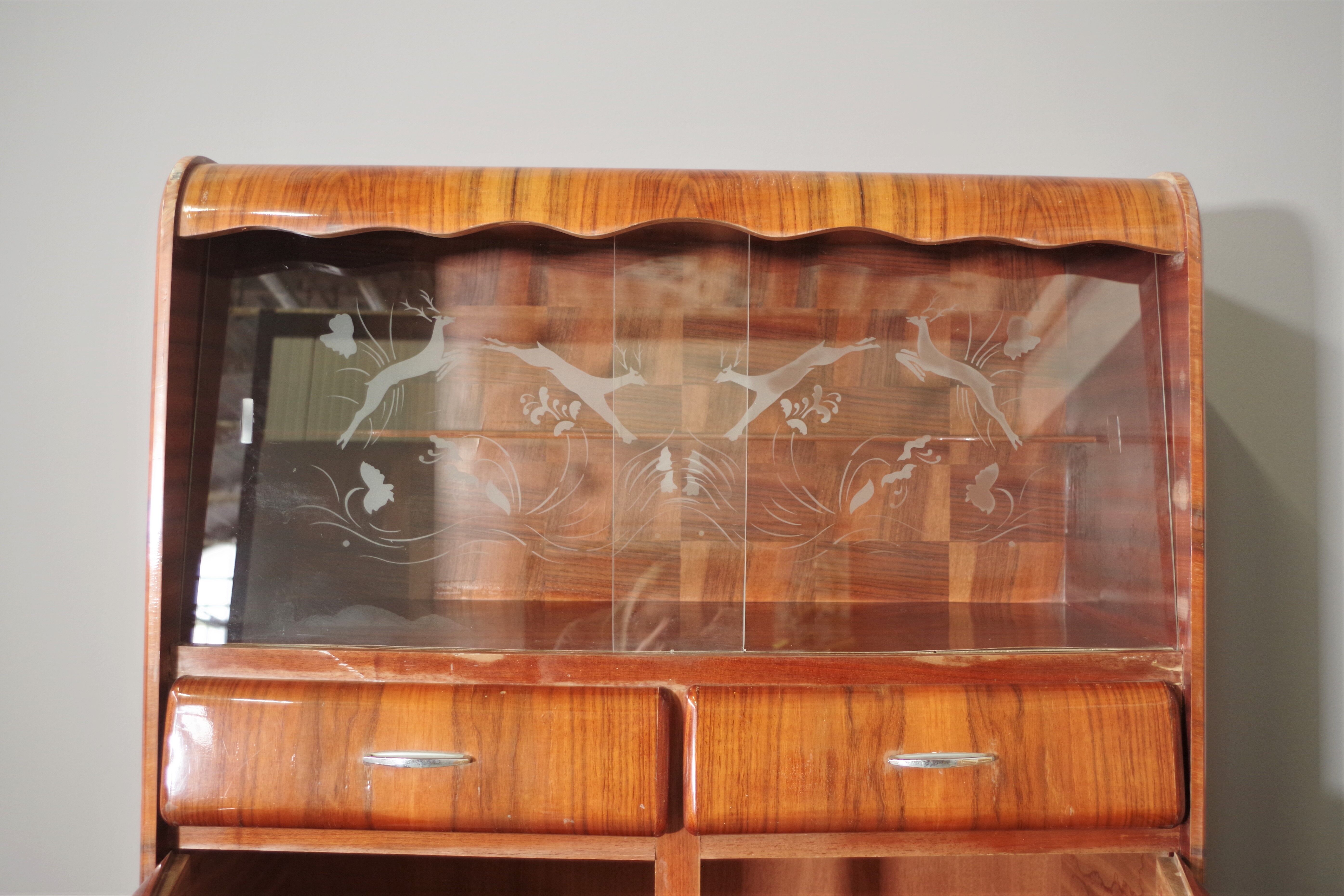 Rounded furniture from the 1950s in cherry veneer