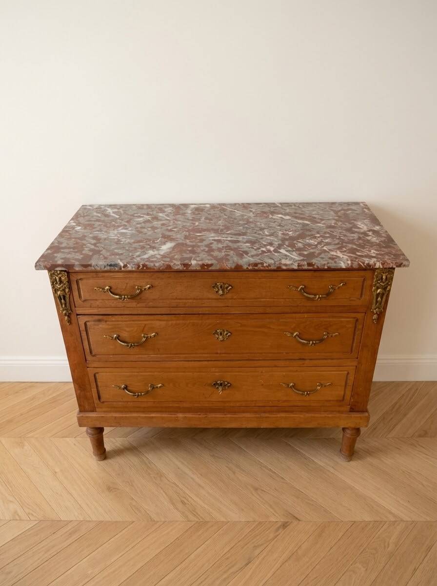 Antique wooden commode with marble and brass.