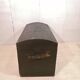 Large travel trunk in blackened wood