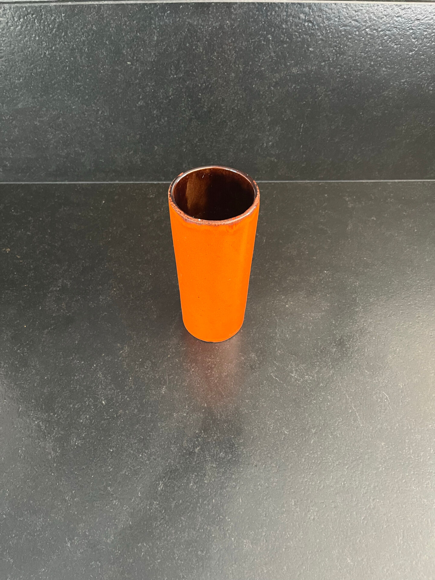 Orange glazed ceramic cylinder vase