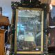 Antique bevelled mirror from the 19th century, sculpted and gilded frame.