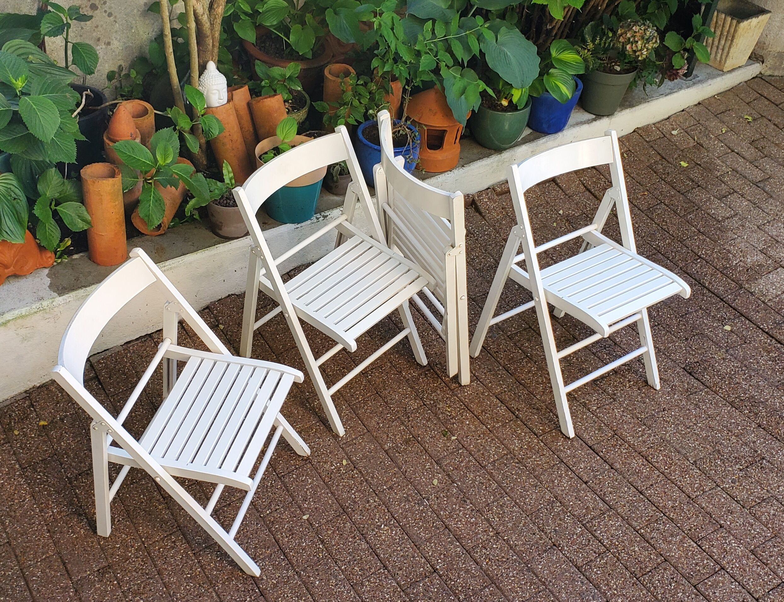 4 folding chairs made of 70's wood