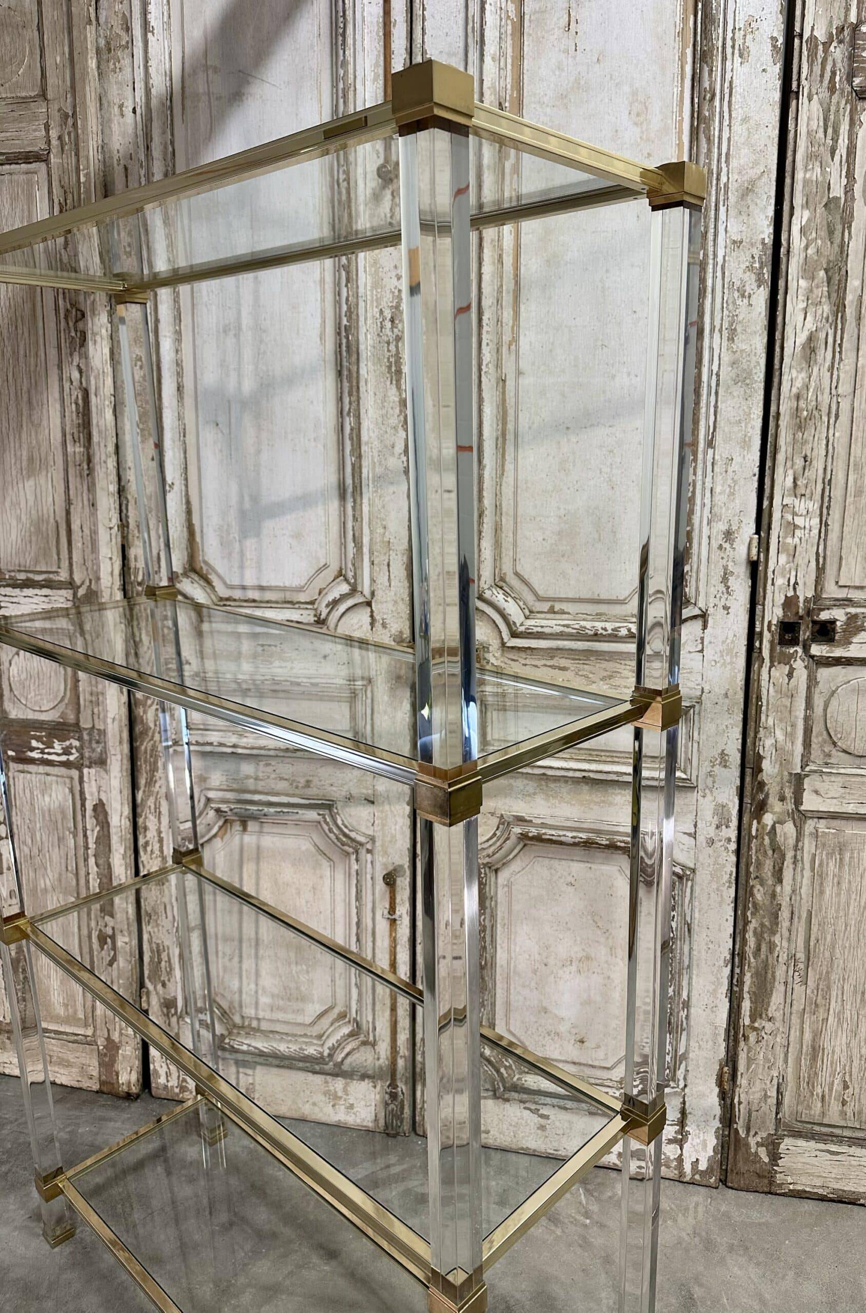 Plexiglass shelf by Pierre Vandel in Hollywood Regency style circa 1970.