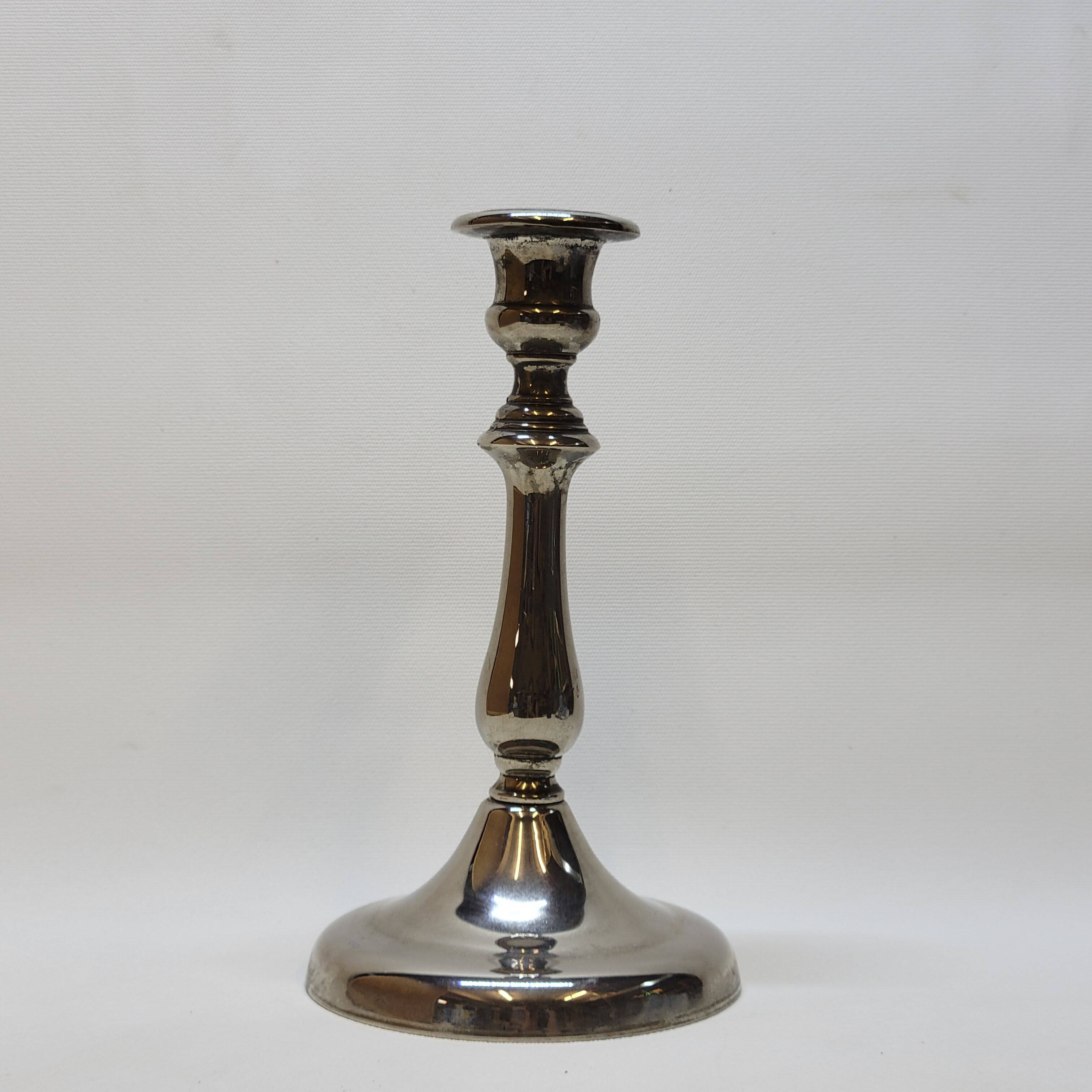 Old candle holder in silver metal