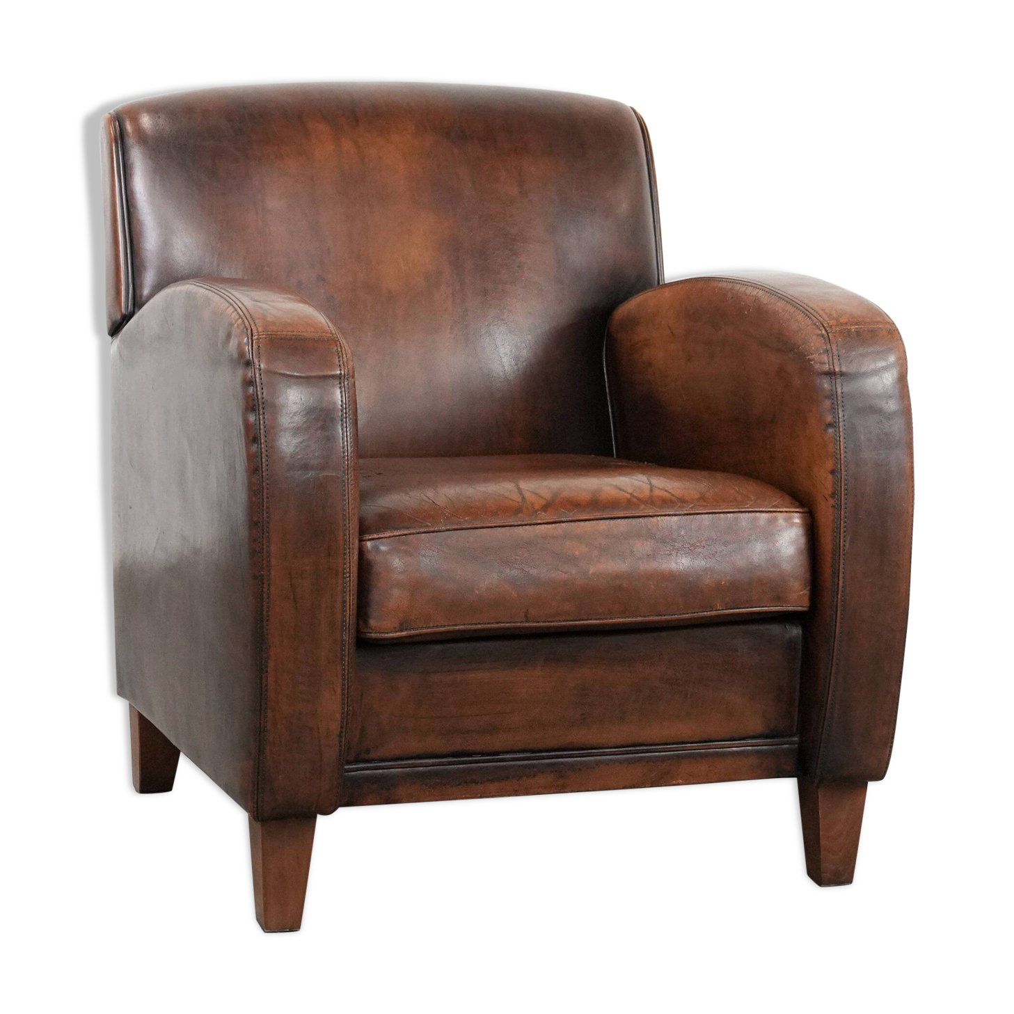 Beautifully shaped vintage sheepskin armchair with character