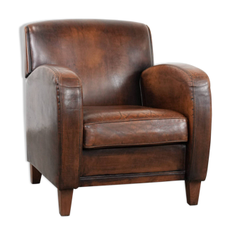 Beautifully shaped vintage sheepskin armchair with character
