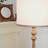 Vintage floor lamp in turned wood with aged effect.