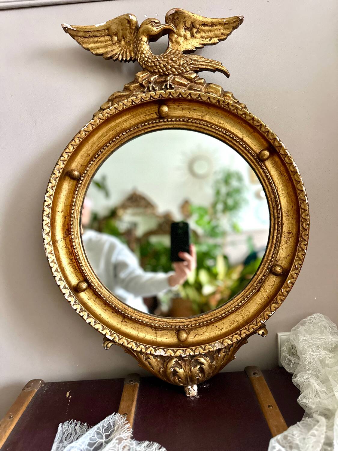 Antique gilded mirror decorated with an eagle