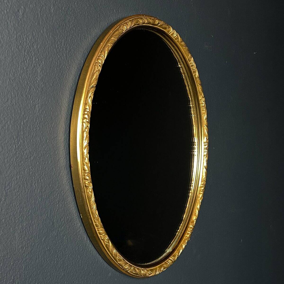 Vintage mirror in a brass frame, Italy, 1950s.